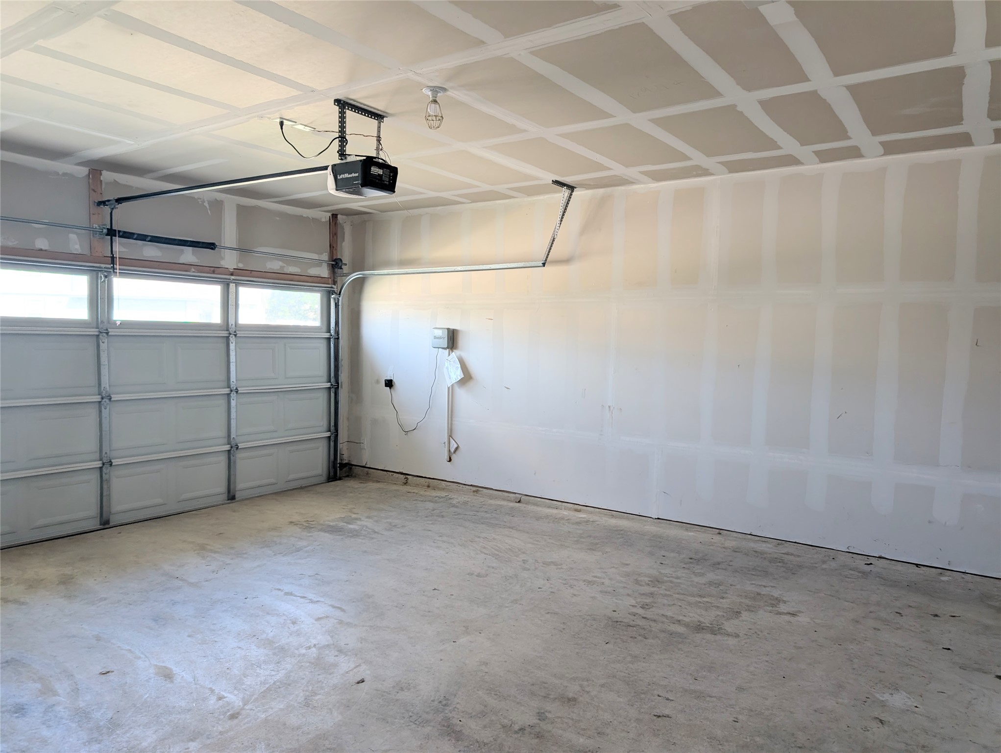 261 Century Plant Road Leander, TX 78641 - Photo 20 of 25 A spacious, unadorned garage offers ample parking and storage potential.