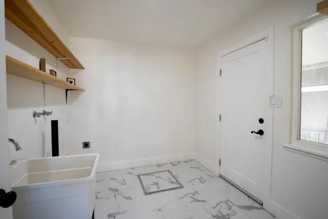a bathroom with a bathtub and window