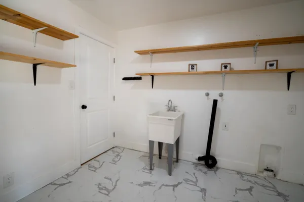 a view of a room with racks on the wall