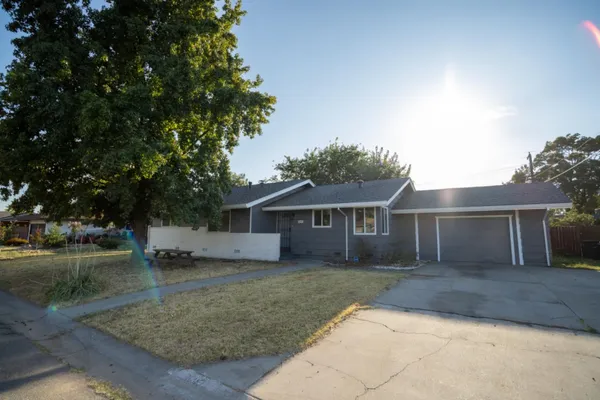 front view of a house with a yard
