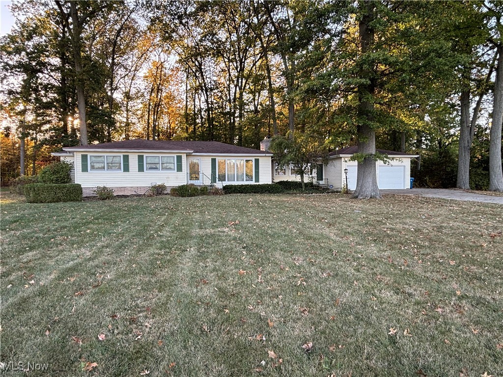 1900 Jaycox Road Avon, OH 44011 - Photo 2 of 26 Ranch-style house featuring a front yard and view of scattered trees
