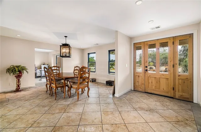 a kitchen with a stove a refrigerator and a sink