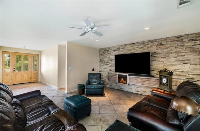 a kitchen with stainless steel appliances kitchen island granite countertop a sink and cabinets