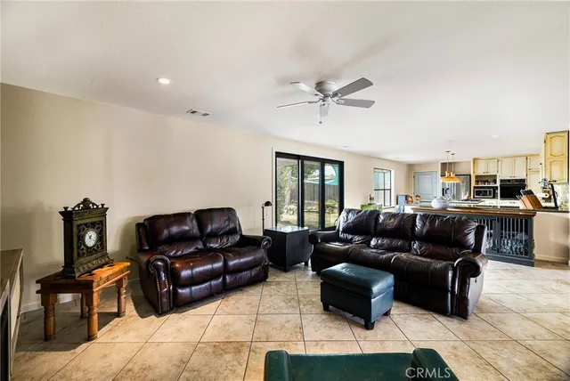 a view of a dining room with furniture and a potted plant