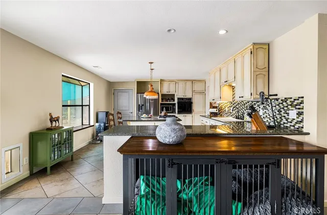 a dining room with furniture and a potted plant