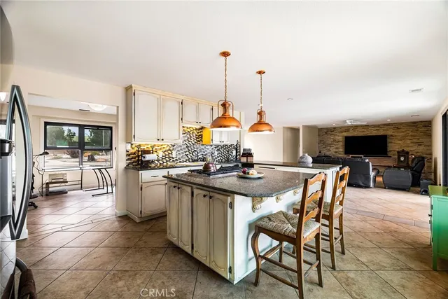 a spacious bathroom with a sink and a mirror