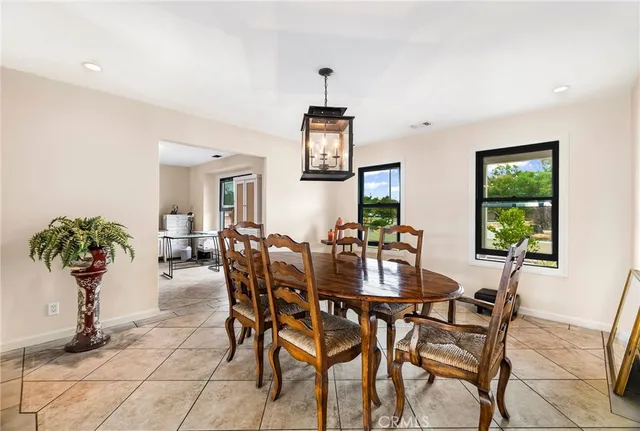 a spacious bathroom with a granite countertop sink and a mirror