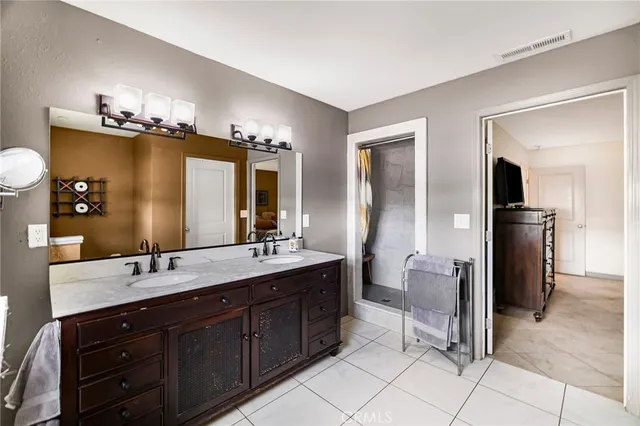 a view of a patio with table and chairs a flat tv screen and couches