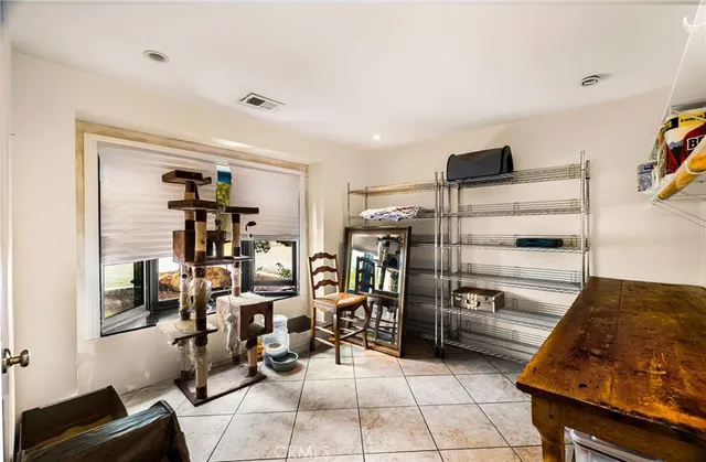 a view of a roof deck with wooden floor and outdoor seating