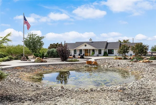 a view of a backyard with sitting area and furniture