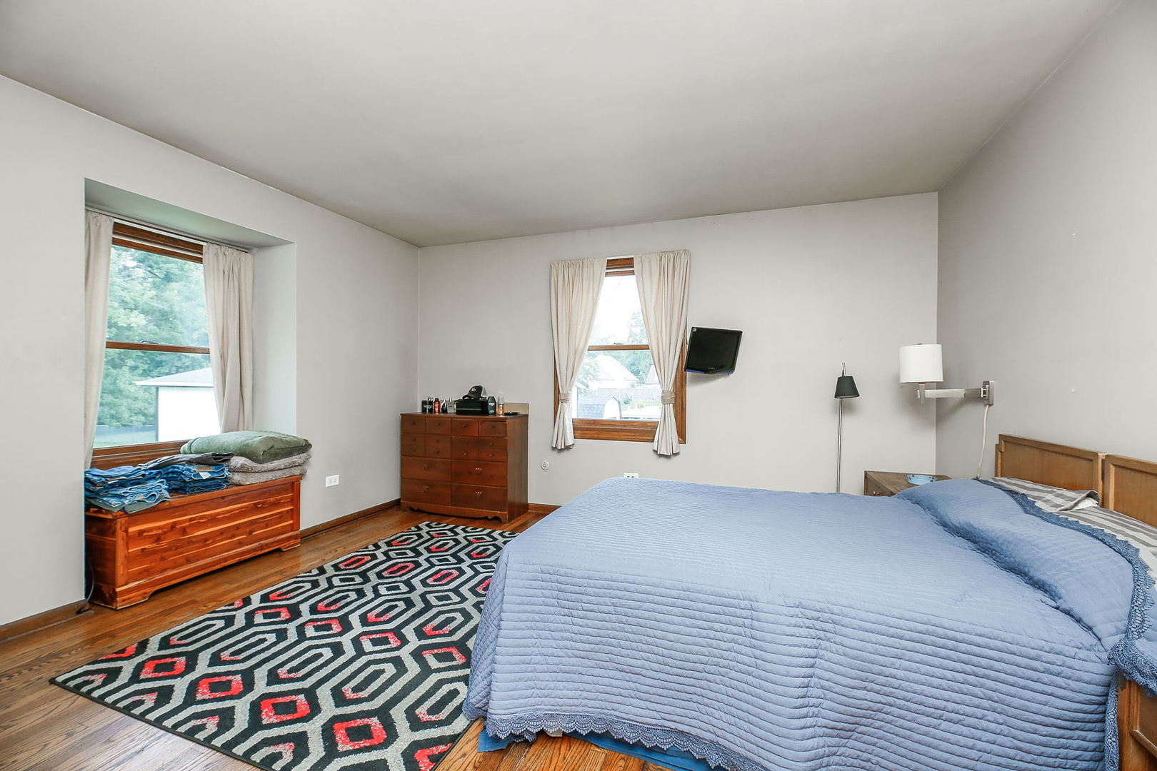 6N476 Thorn Road Hanover Park, IL 60133 - Photo 12 of 35 a bedroom with a bed and wooden floor