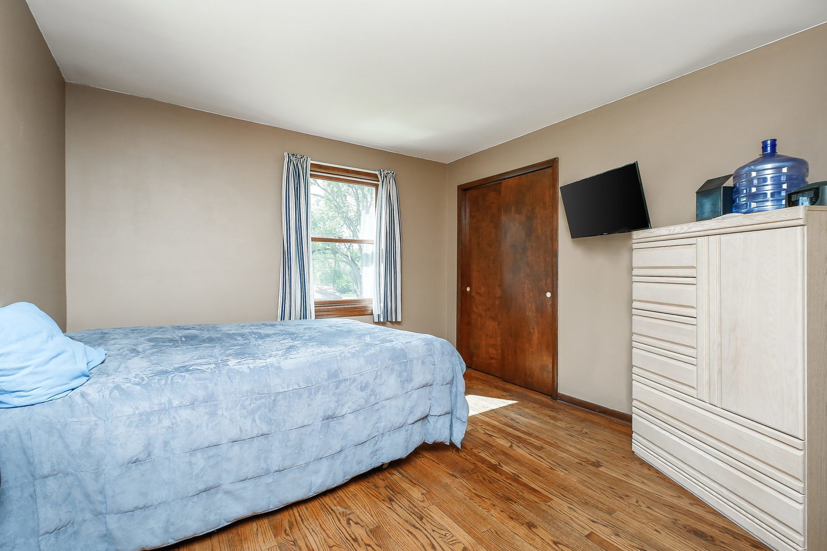 6N476 Thorn Road Hanover Park, IL 60133 - Photo 14 of 35 a bedroom with a bed and wooden floor