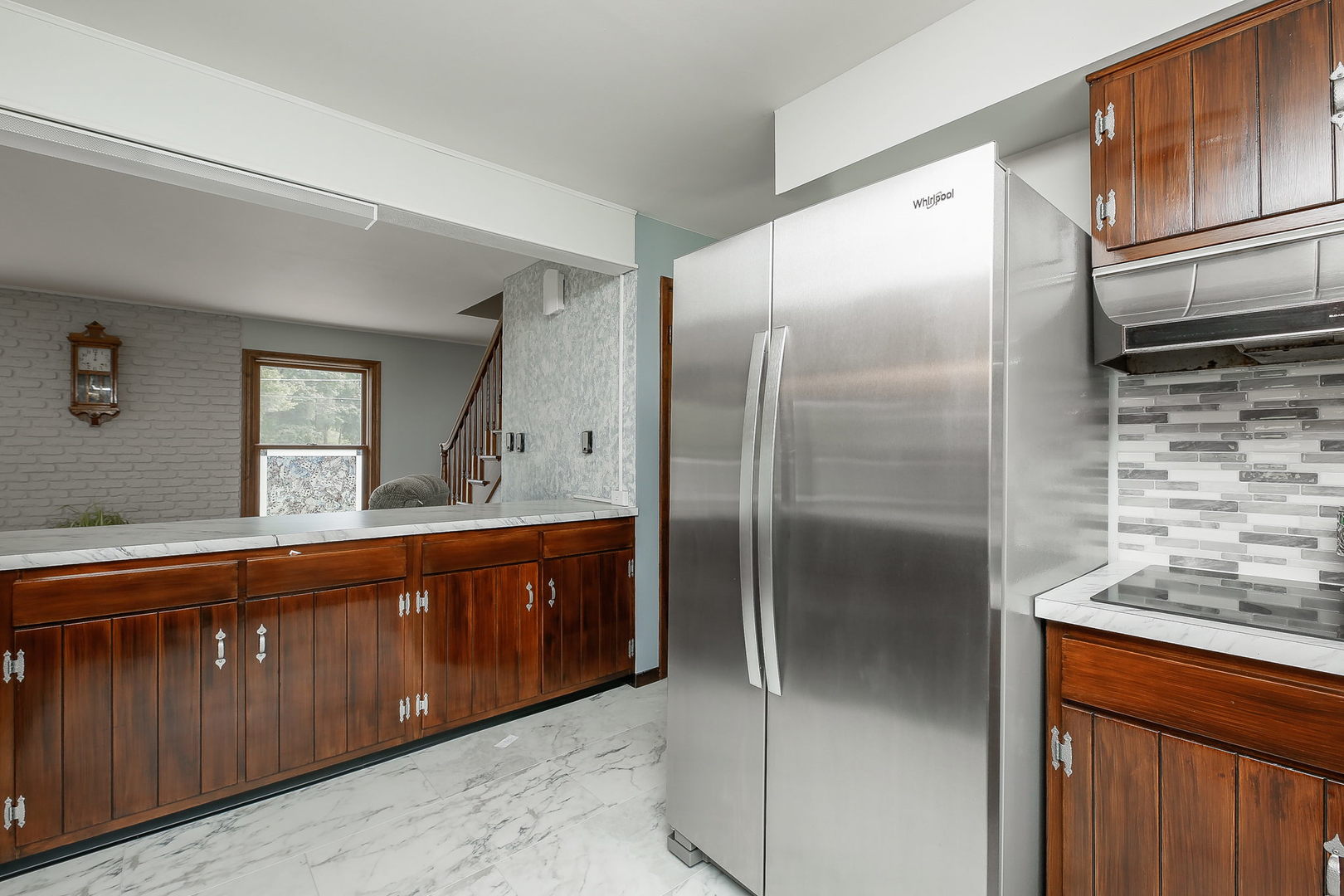 6N476 Thorn Road Hanover Park, IL 60133 - Photo 2 of 35 a large kitchen with a refrigerator and a sink