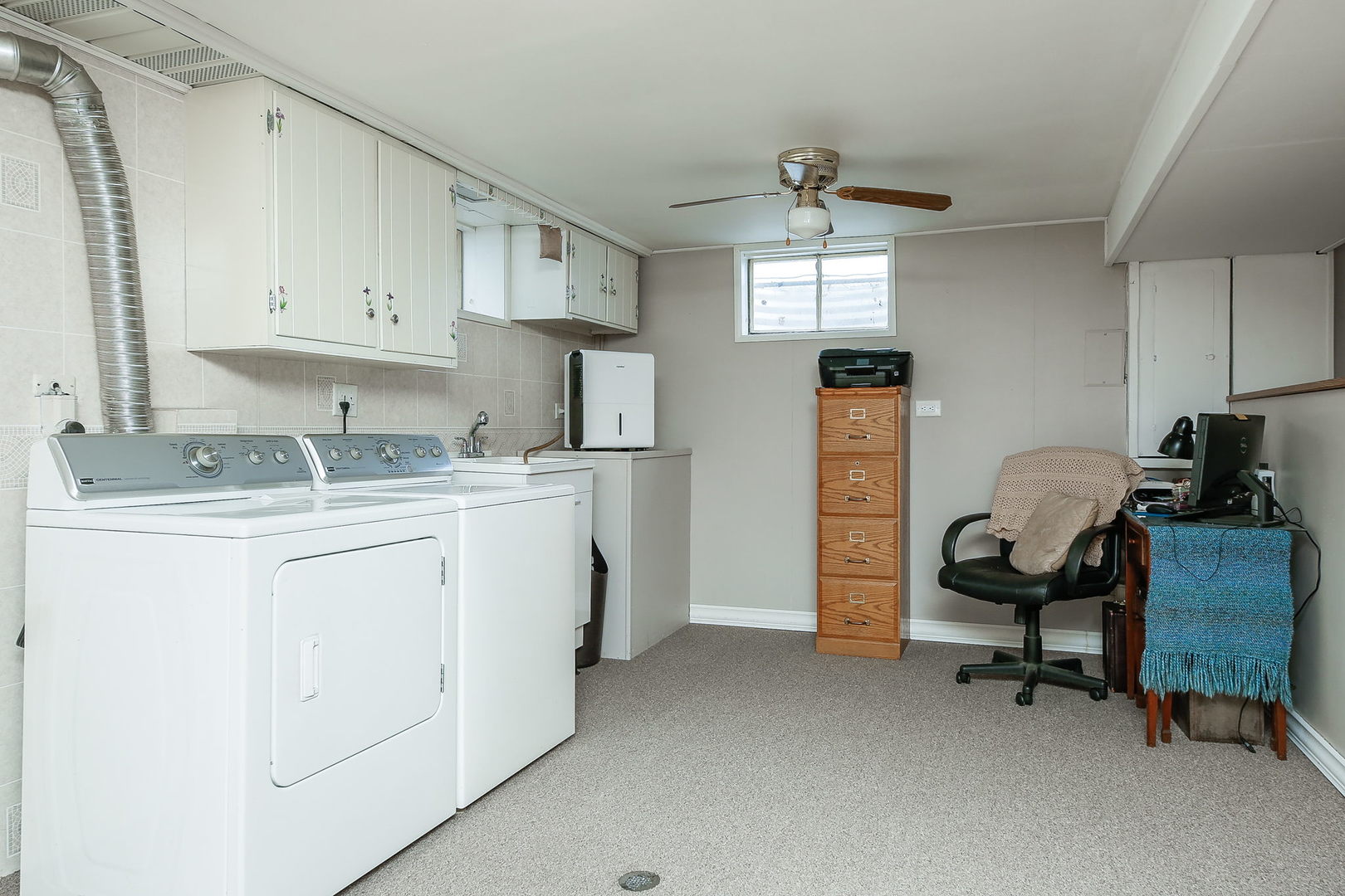 6N476 Thorn Road Hanover Park, IL 60133 - Photo 22 of 35 a room that has a couch and a chair in it