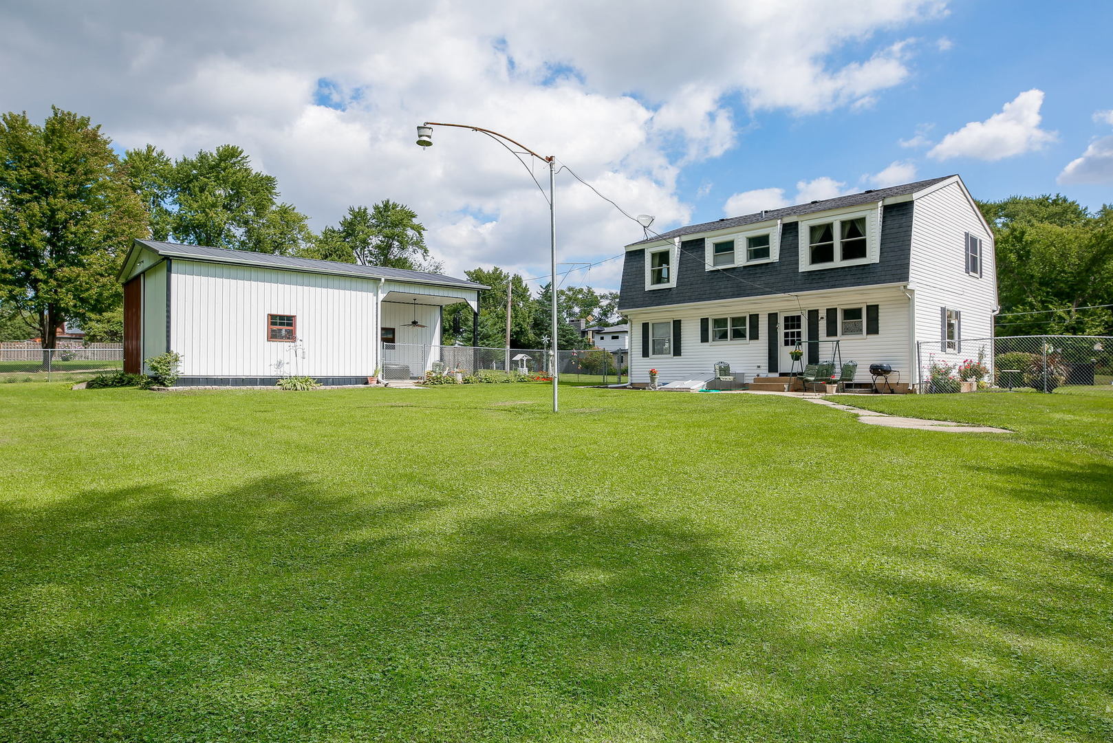 6N476 Thorn Road Hanover Park, IL 60133 - Photo 24 of 35 a front view of house with yard and trees