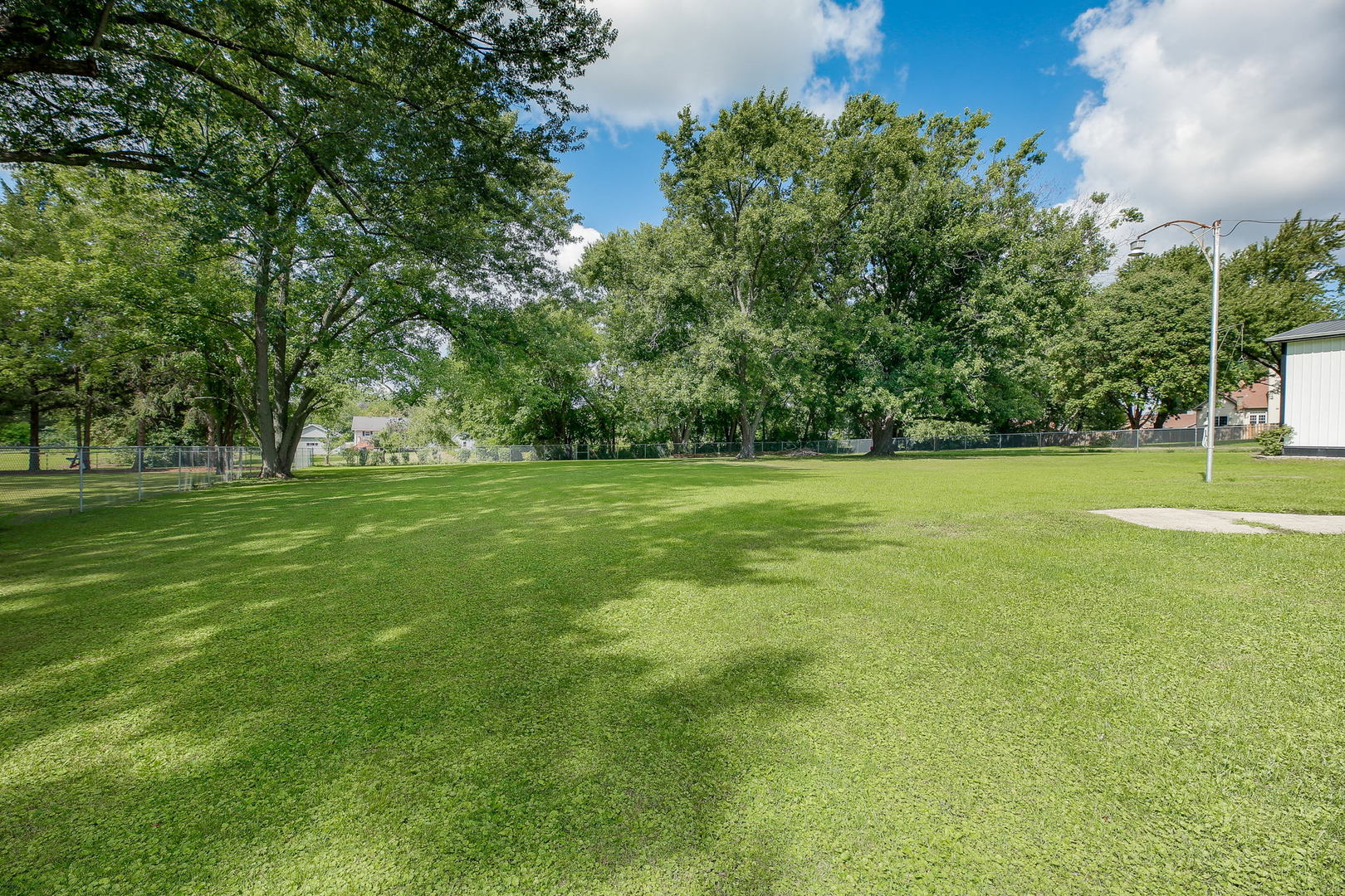 6N476 Thorn Road Hanover Park, IL 60133 - Photo 32 of 35 a view of a grassy field with trees