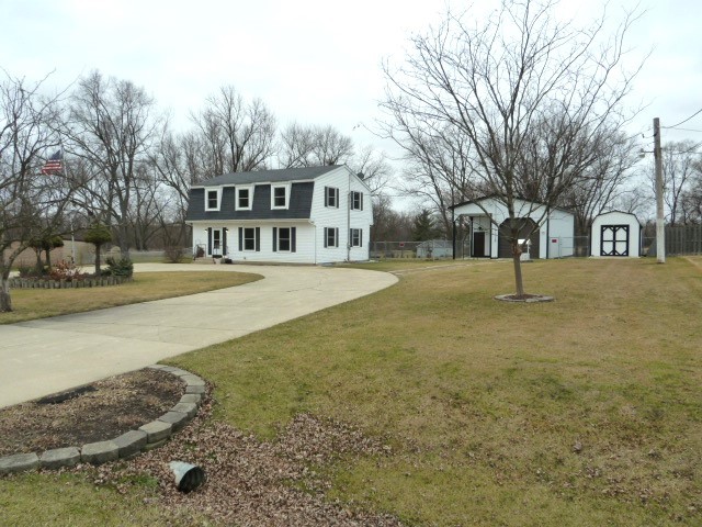 6N476 Thorn Road Hanover Park, IL 60133 - Photo 33 of 35 a front view of a building with trees