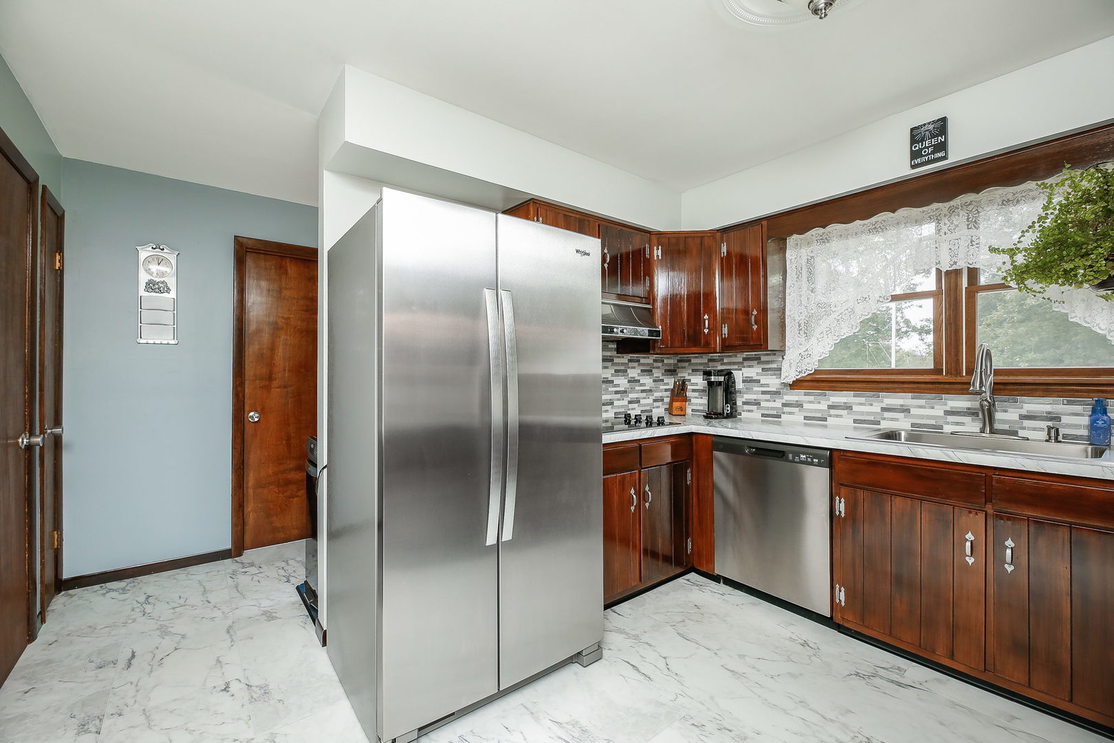 6N476 Thorn Road Hanover Park, IL 60133 - Photo 4 of 35 a kitchen with stainless steel appliances granite countertop a refrigerator a sink a stove and a wooden cabinets