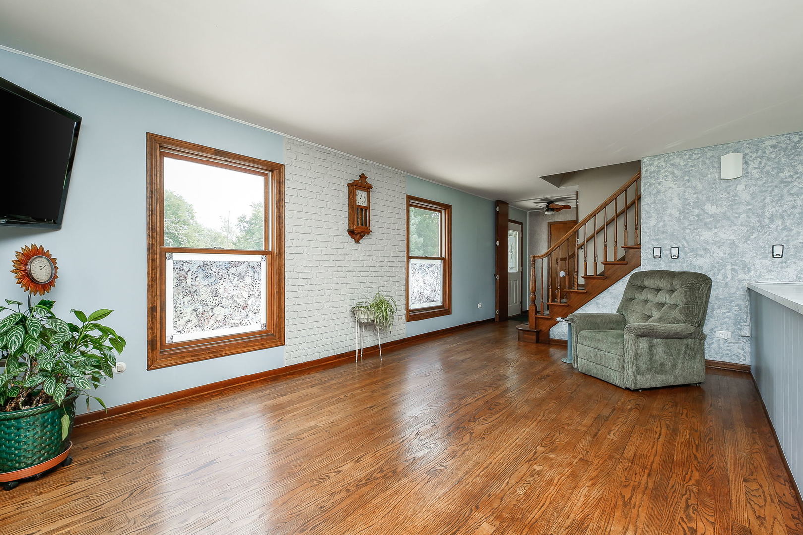 6N476 Thorn Road Hanover Park, IL 60133 - Photo 6 of 35 a view of an empty room with a window and wooden floor
