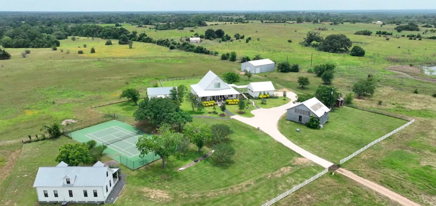 an aerial view of a houses with outdoor space