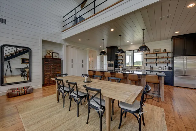 a view of a dining area with furniture and wooden floor