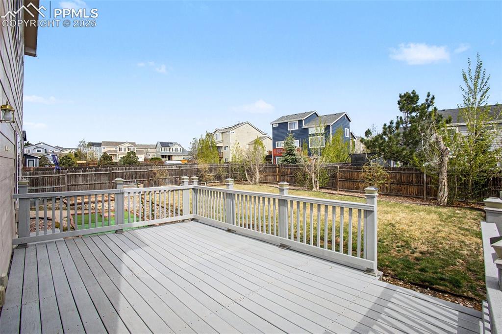 12210 Crystal Downs Road Peyton, CO 80831 - Photo 28 of 40 a view of a balcony with wooden floor and city view