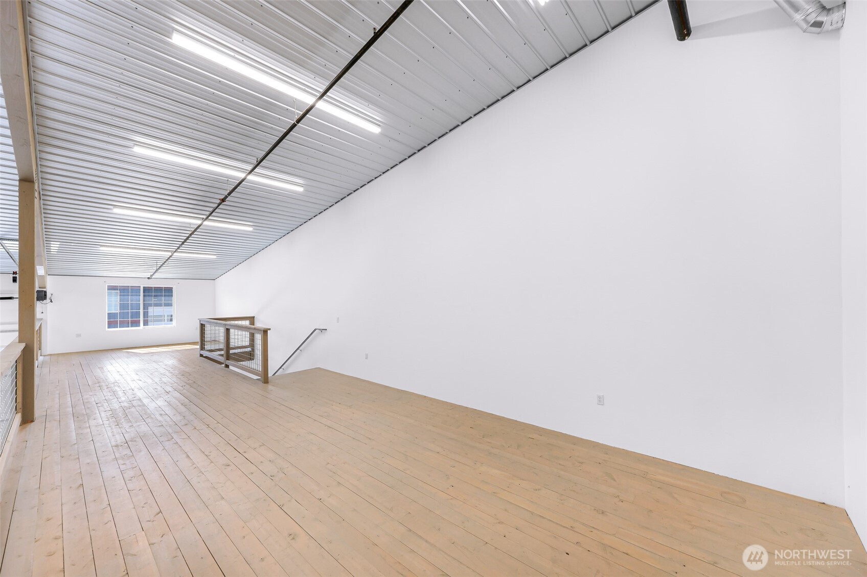 1957 Baltic Way, Unit 111 Ferndale, WA 98248 - Photo 19 of 27 a view of a room with wooden floor