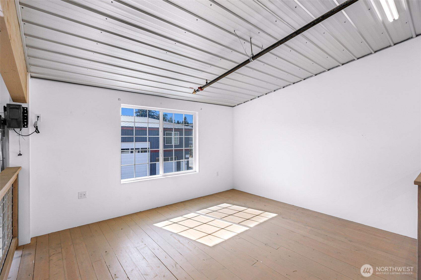 1957 Baltic Way, Unit 111 Ferndale, WA 98248 - Photo 24 of 27 a view of an empty room with a window