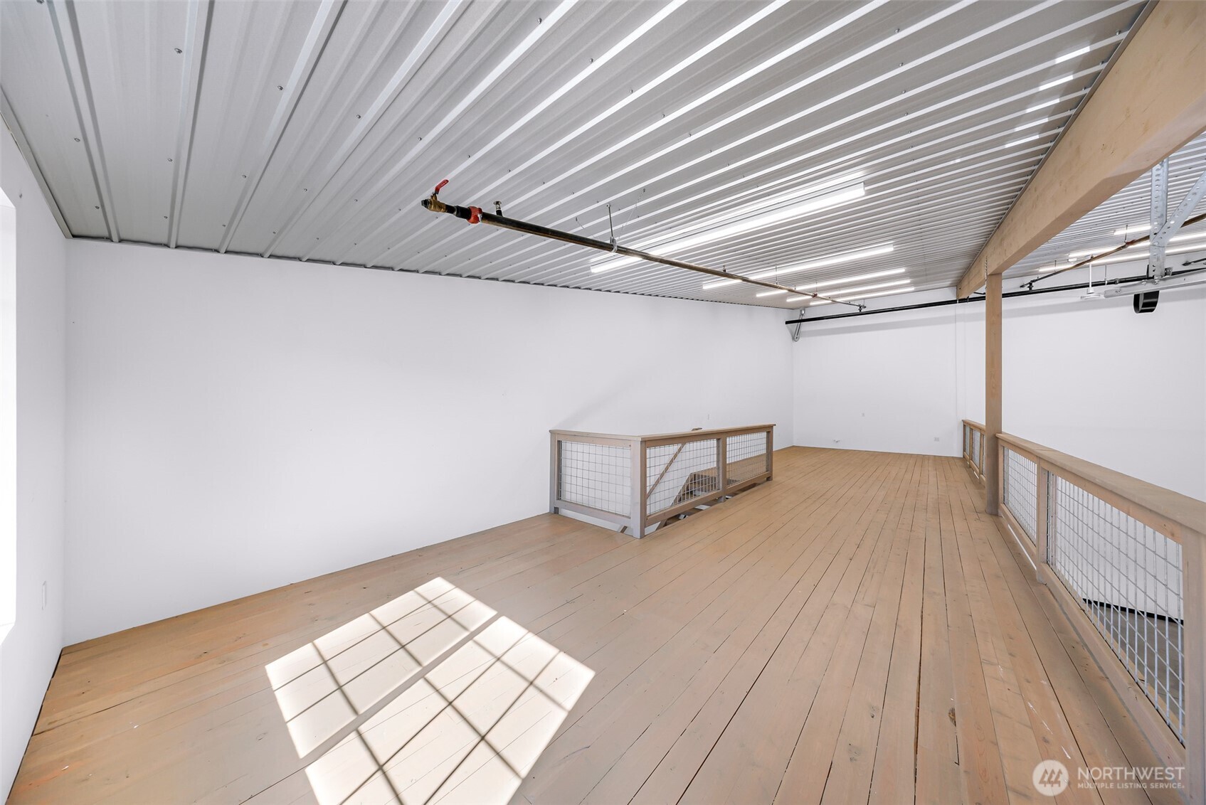 1957 Baltic Way, Unit 111 Ferndale, WA 98248 - Photo 27 of 27 a view of empty room with wooden floor