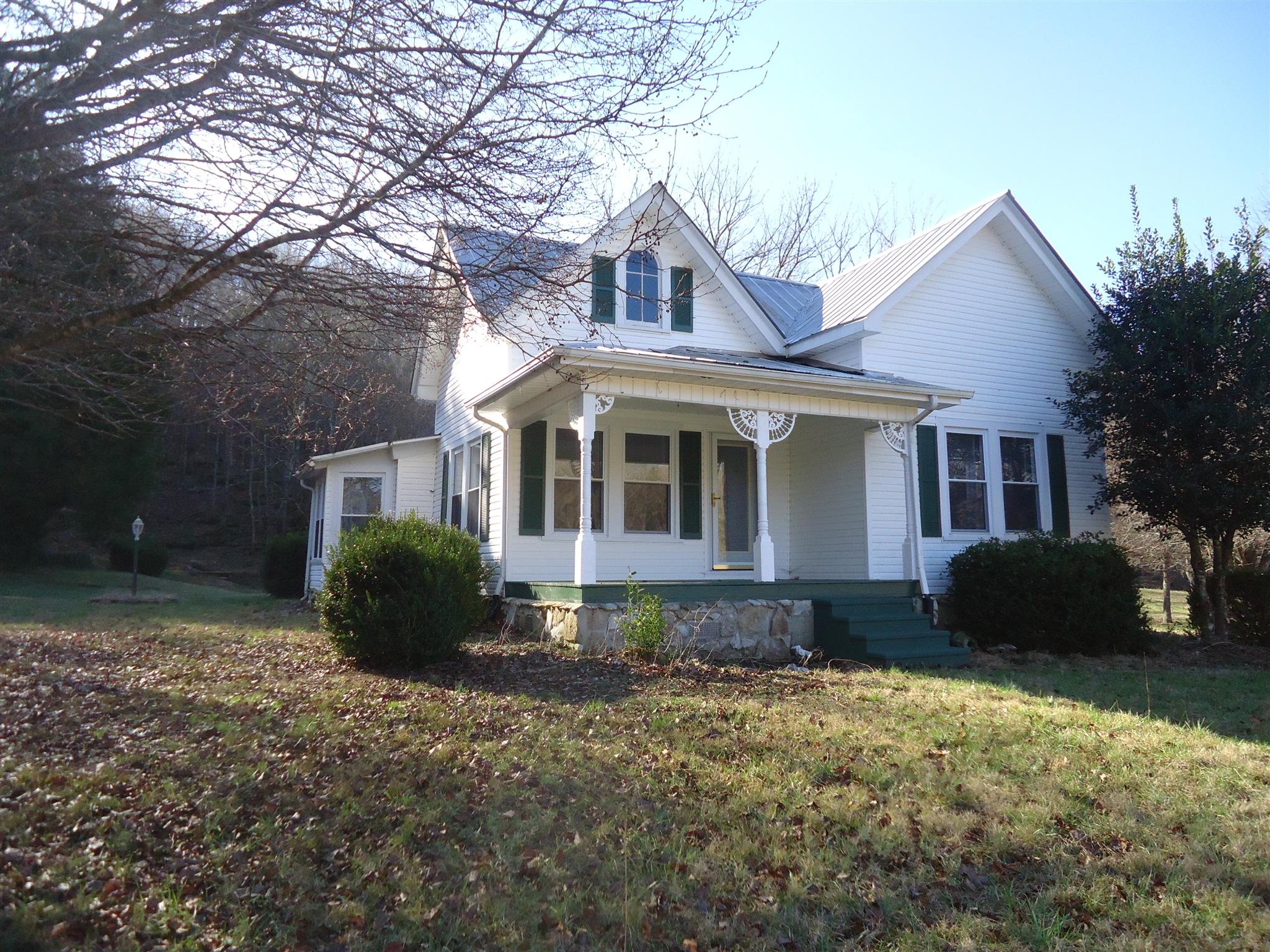 8101 Prospect Road Prospect, TN 38477 - Photo 1 of 26 a front view of a house with a yard