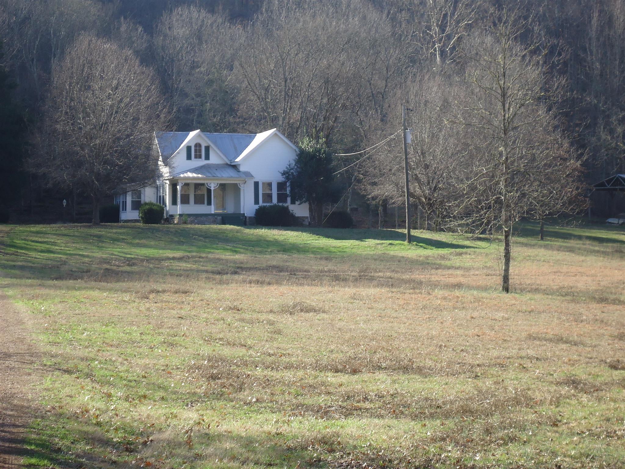 8101 Prospect Road Prospect, TN 38477 - Photo 2 of 26 a front view of a house with a yard