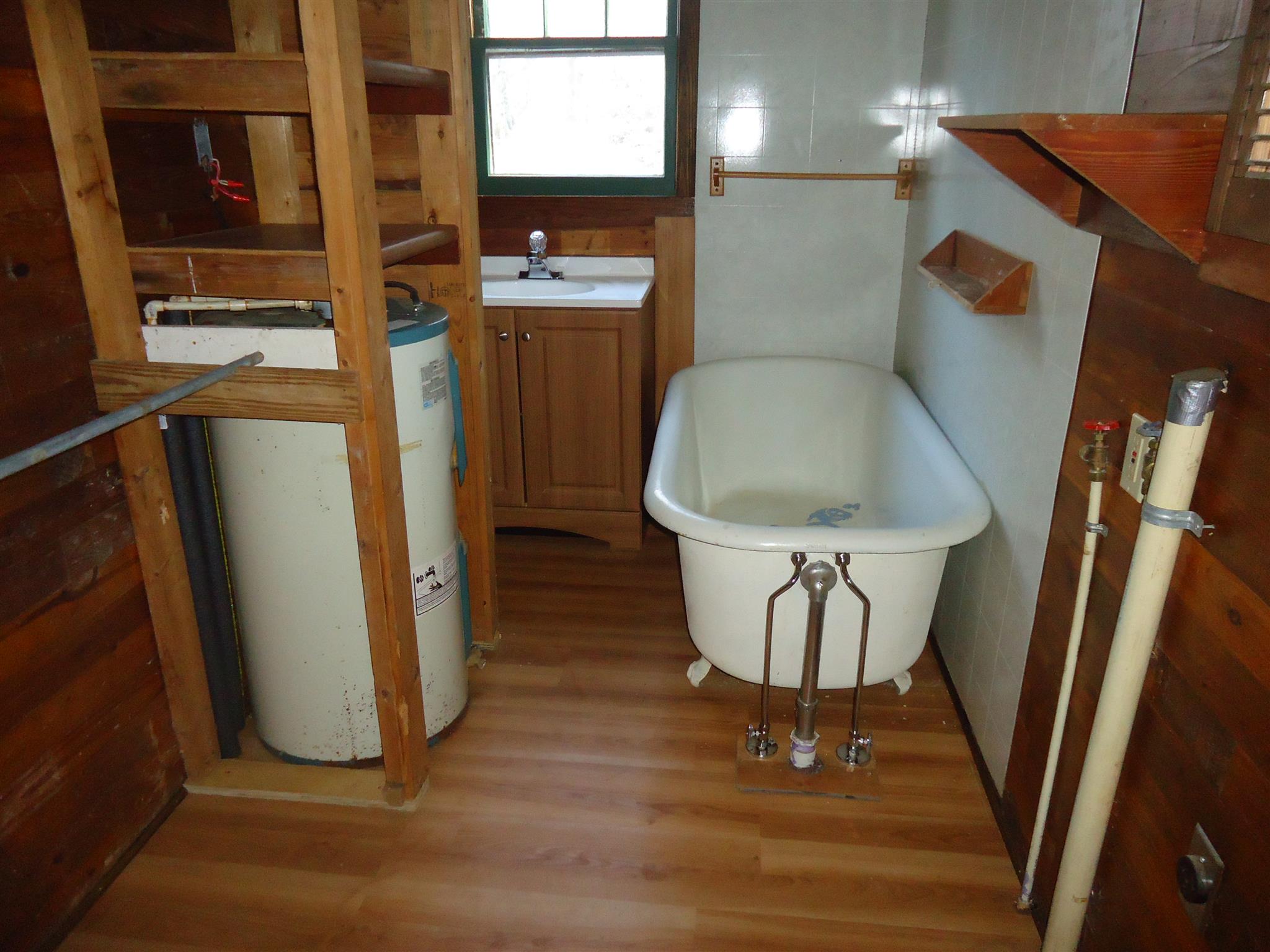 8101 Prospect Road Prospect, TN 38477 - Photo 17 of 26 a bathroom with a sink and a mirror