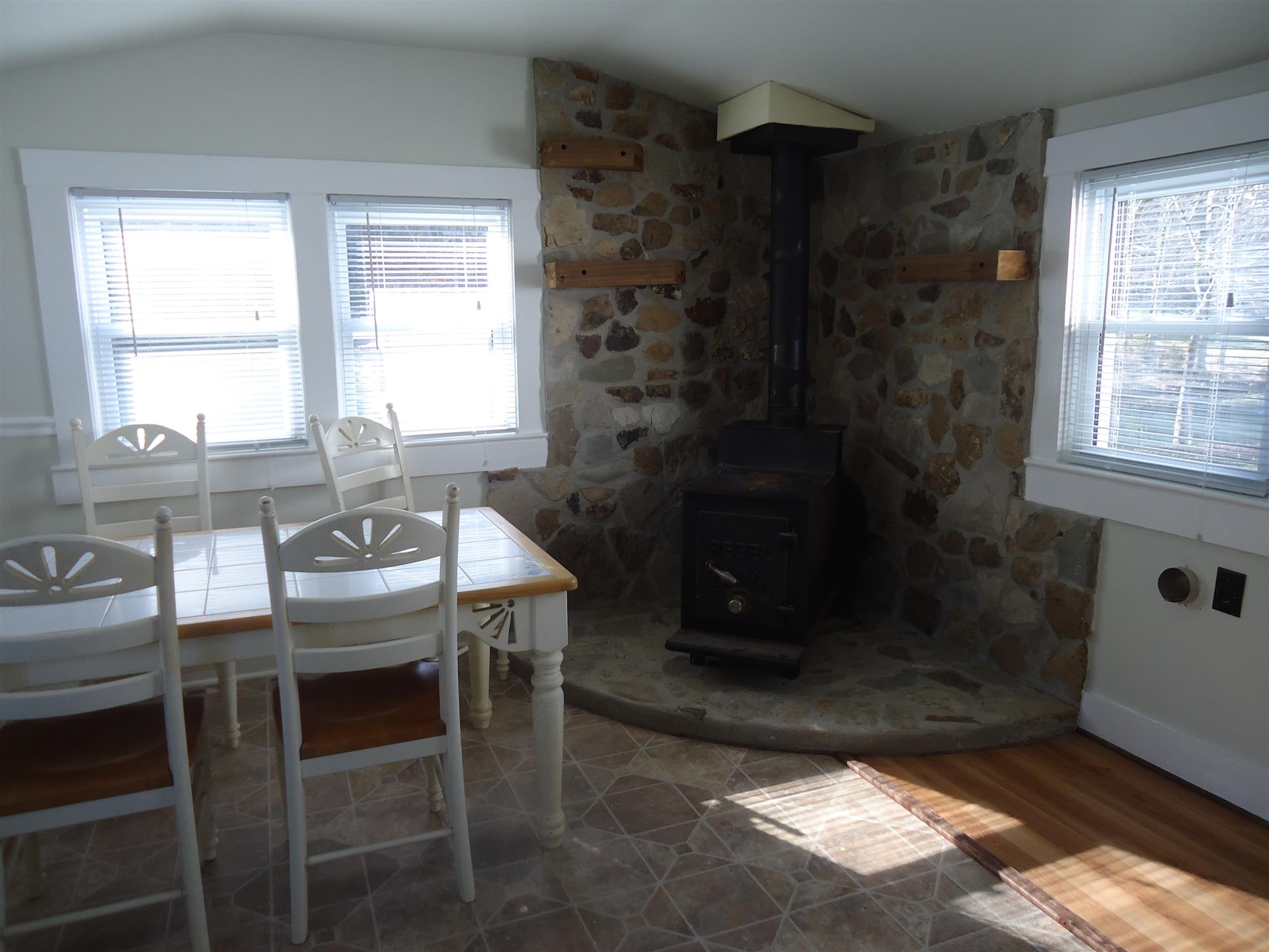 8101 Prospect Road Prospect, TN 38477 - Photo 18 of 26 a dining room with a table and chairs