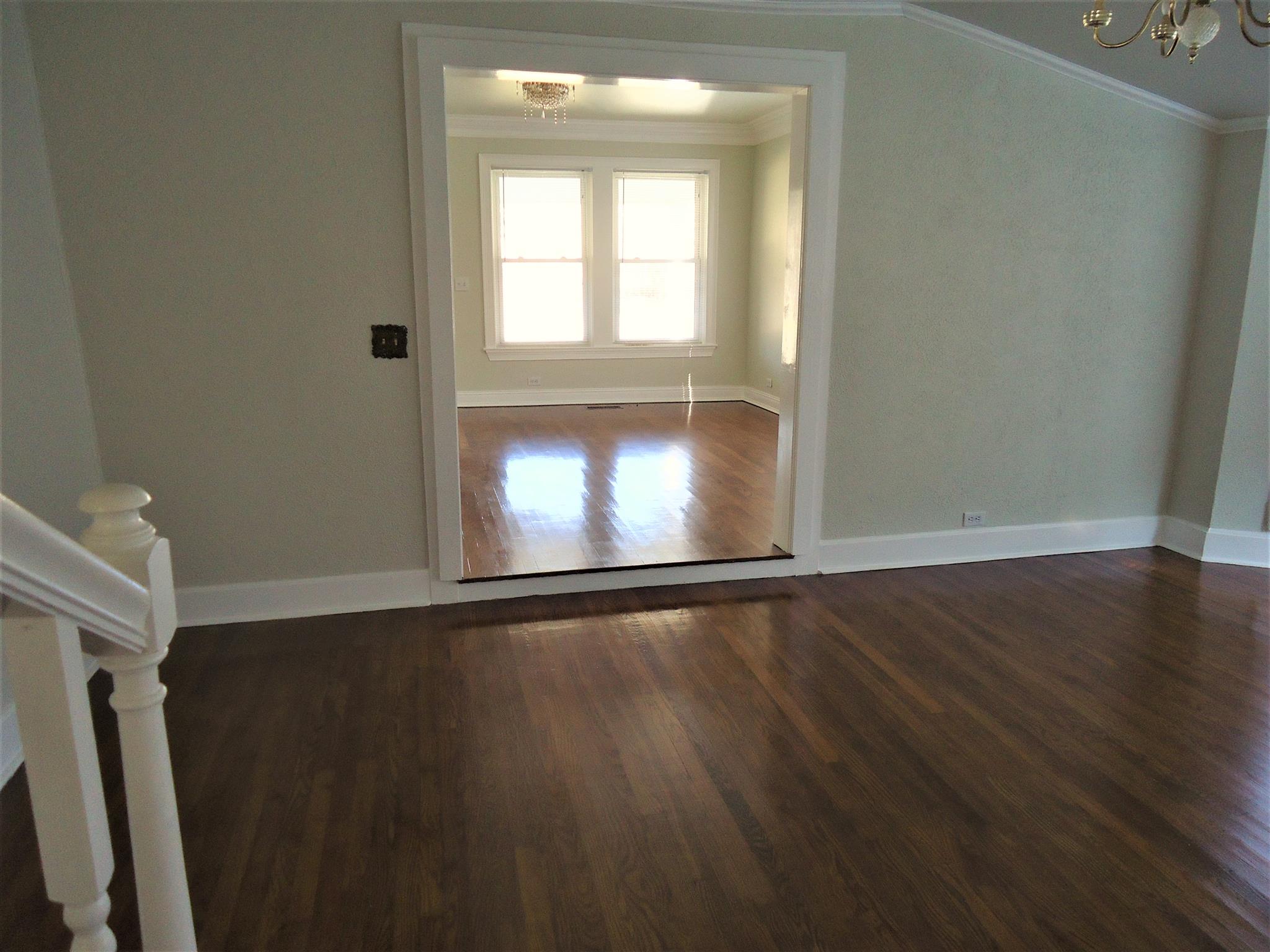 8101 Prospect Road Prospect, TN 38477 - Photo 20 of 26 a view of an empty room with wooden floor and a window