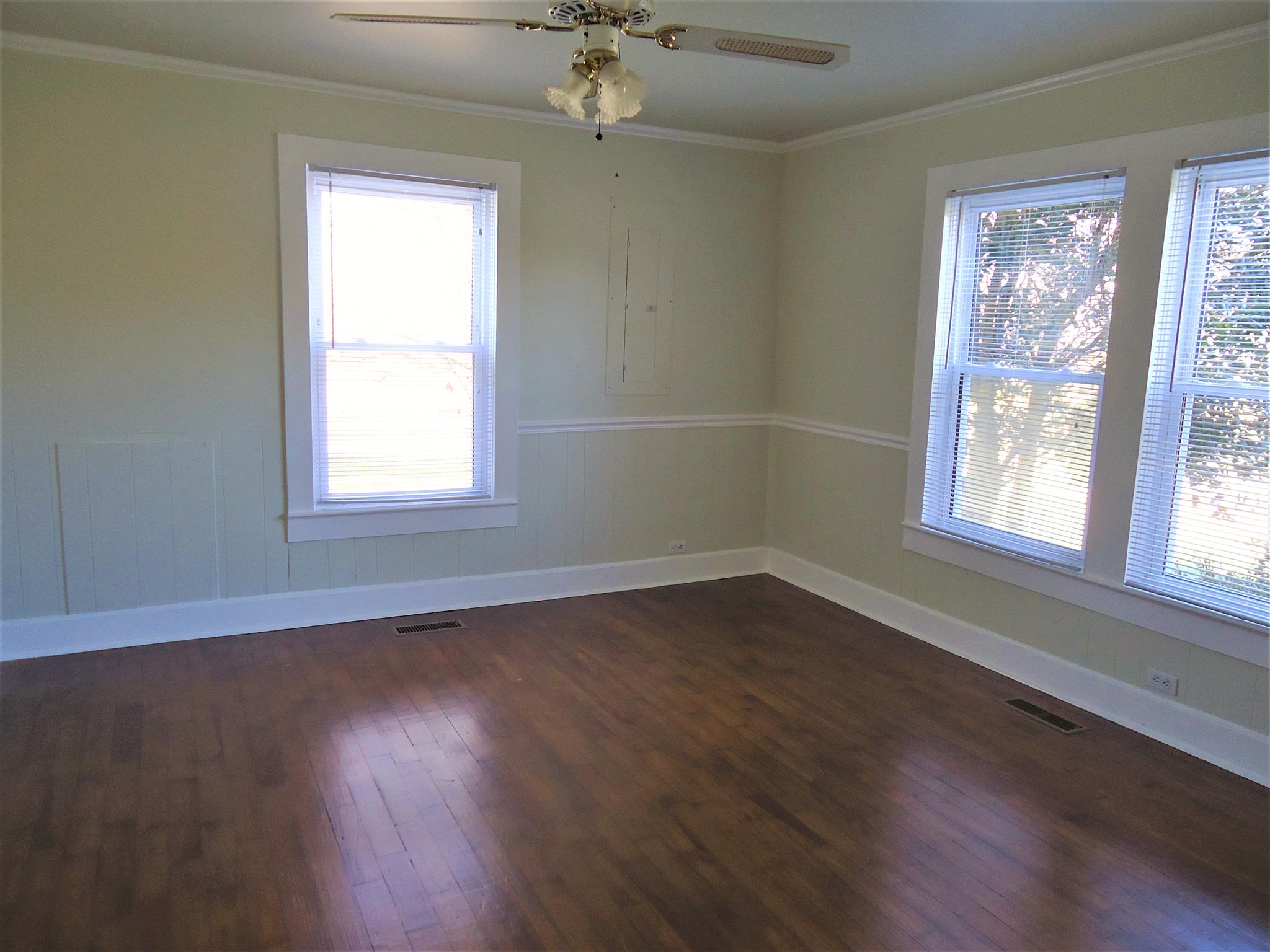 8101 Prospect Road Prospect, TN 38477 - Photo 23 of 26 a view of an empty room with wooden floor and a window
