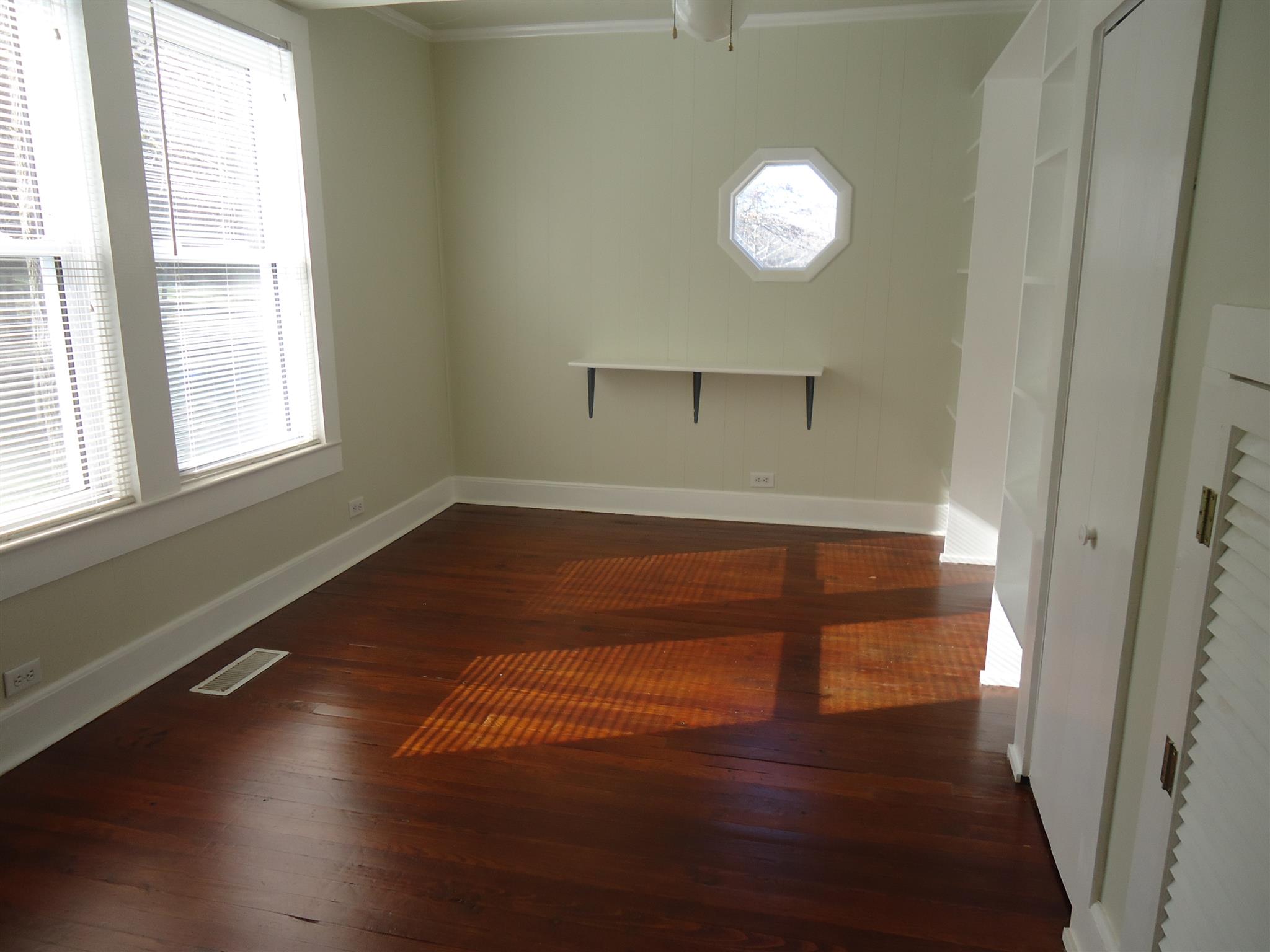 8101 Prospect Road Prospect, TN 38477 - Photo 26 of 26 an empty room with wooden floor and windows
