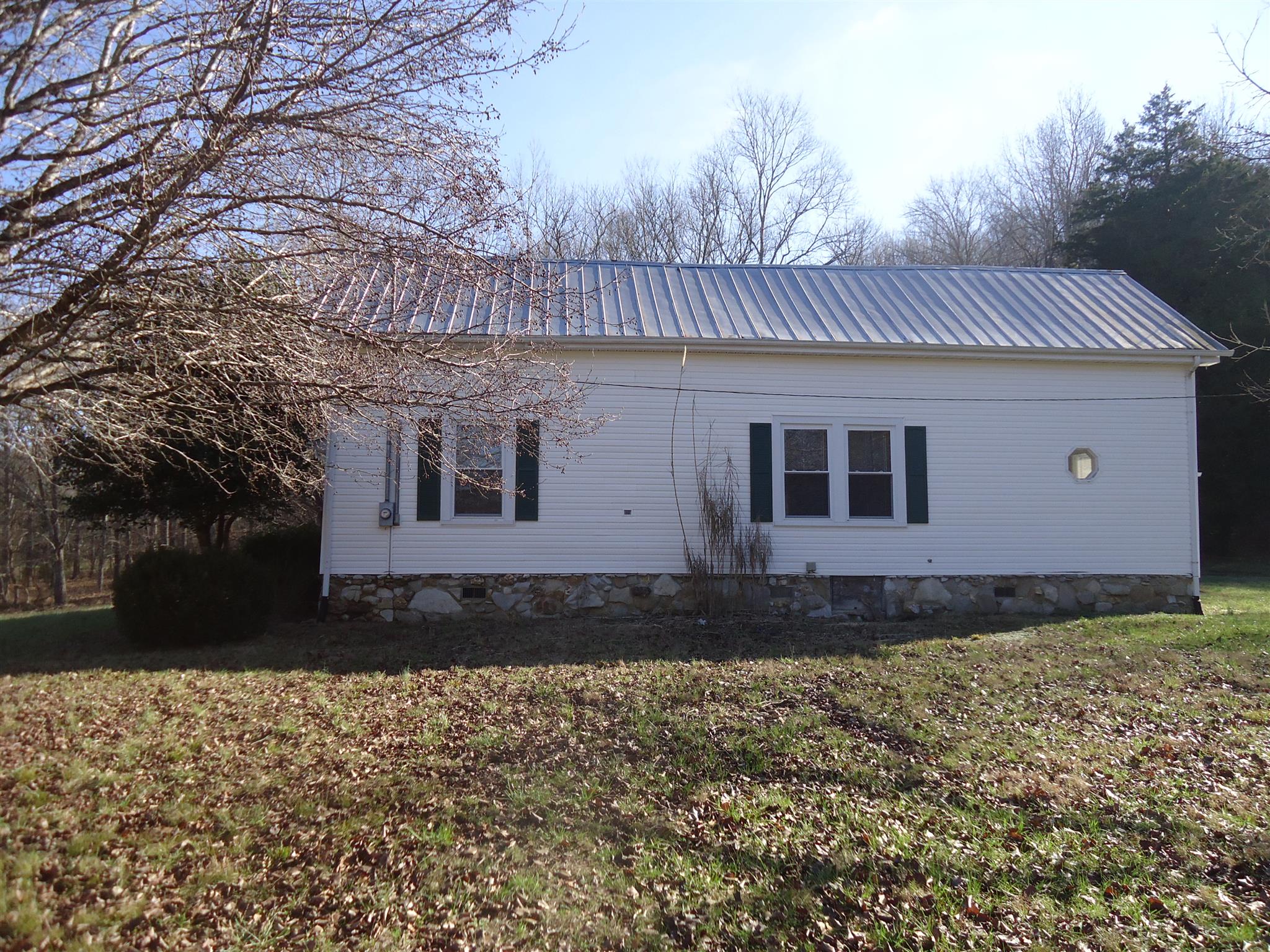 8101 Prospect Road Prospect, TN 38477 - Photo 4 of 26 a front view of a house with a yard