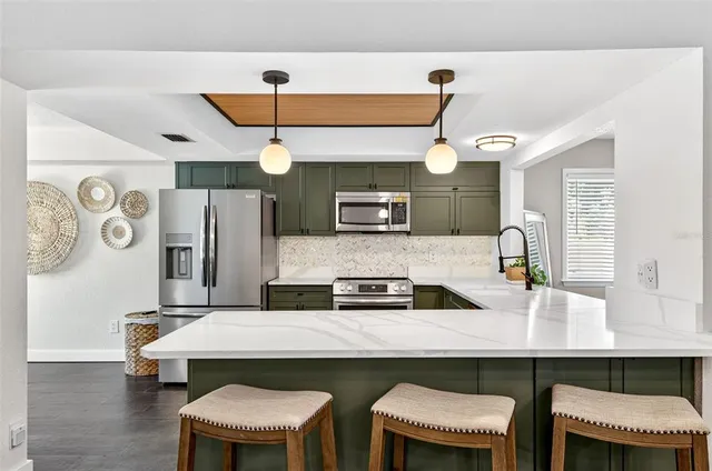 a kitchen with a table and chairs in it