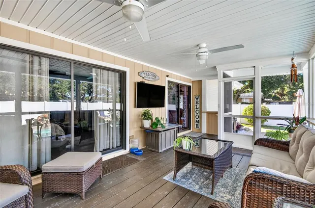 a view of a backyard with sitting area