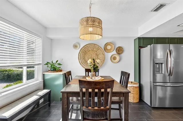 a dining room with furniture and window