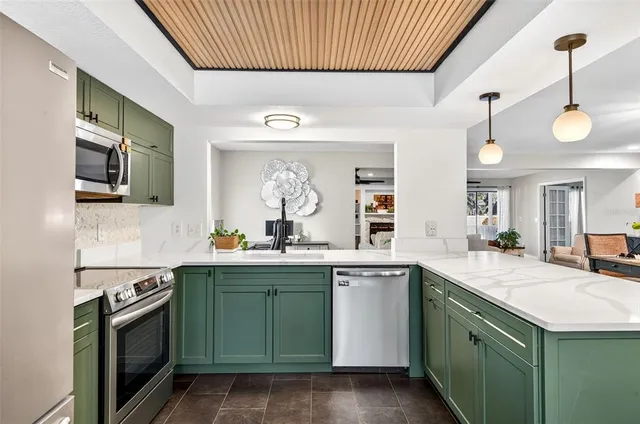 a kitchen with sink and cabinets