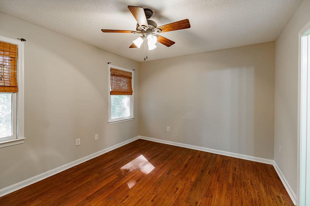 345 Research Drive, Unit 330 Athens, GA 30605 - Photo 12 of 31 an empty room with wooden floor and windows