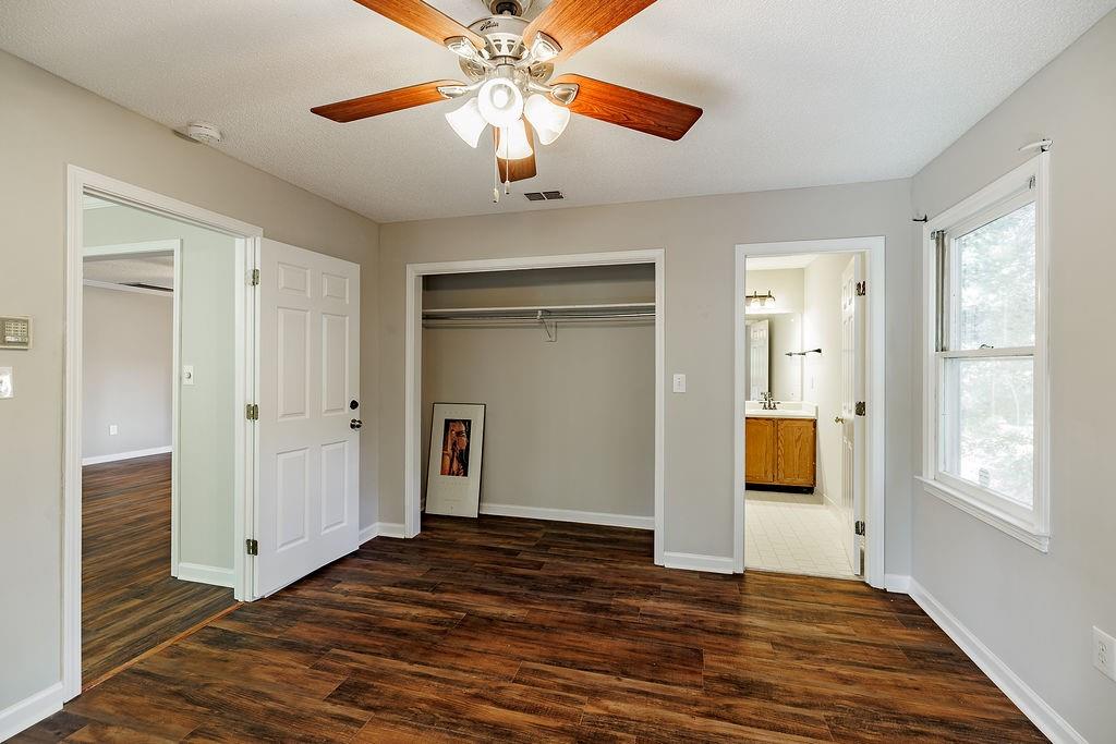 345 Research Drive, Unit 330 Athens, GA 30605 - Photo 15 of 31 a view of a room with wooden floor and a ceiling fan