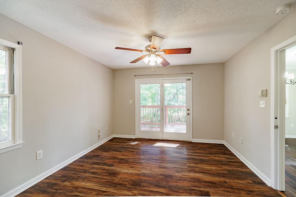 345 Research Drive, Unit 330 Athens, GA 30605 - Photo 16 of 31 wooden floor in an empty room with a window