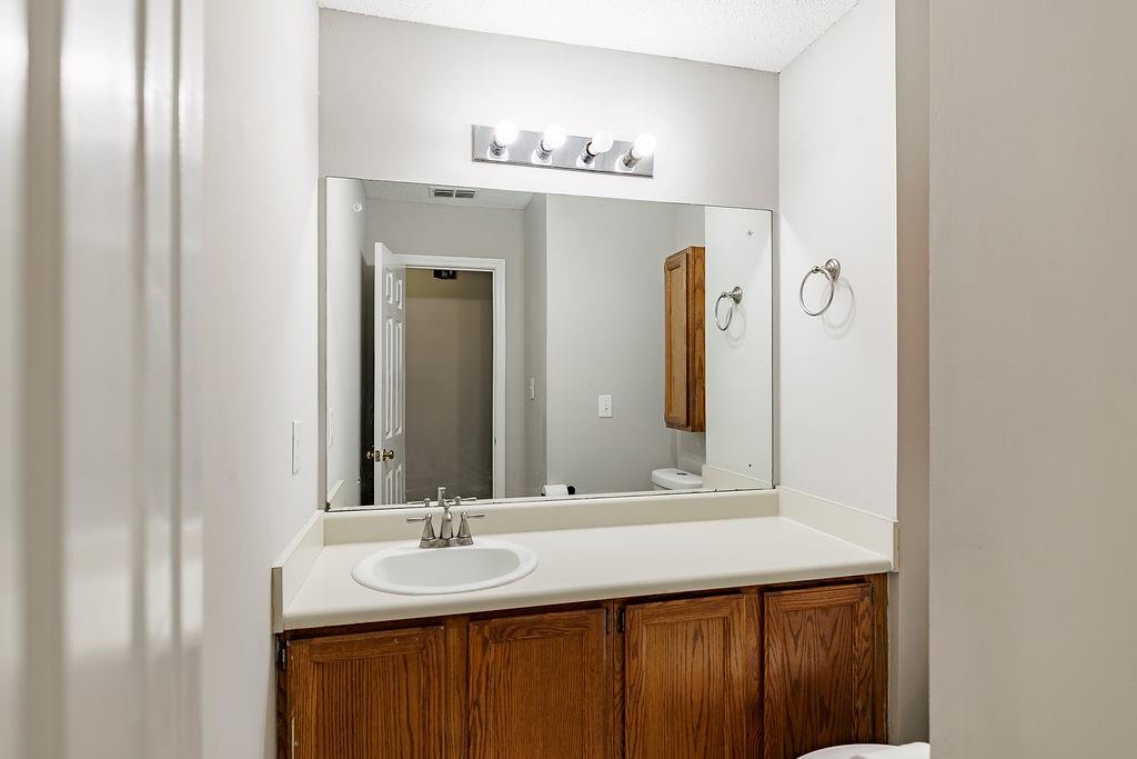 345 Research Drive, Unit 330 Athens, GA 30605 - Photo 18 of 31 a bathroom with a double vanity sink and a mirror