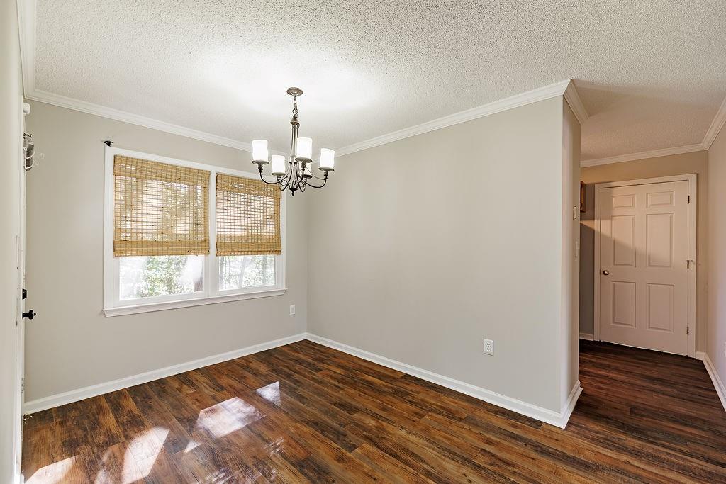 345 Research Drive, Unit 330 Athens, GA 30605 - Photo 19 of 31 a view of an empty room with wooden floor and a window