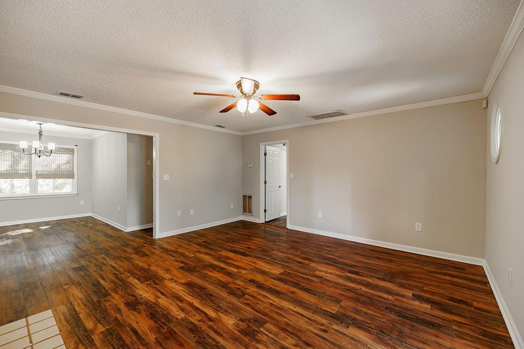 345 Research Drive, Unit 330 Athens, GA 30605 - Photo 23 of 31 a view of an empty room with chandelier fan and wooden floor