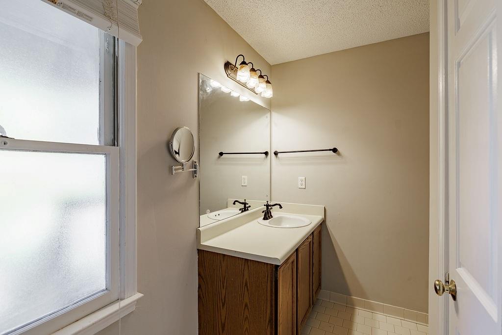 345 Research Drive, Unit 330 Athens, GA 30605 - Photo 24 of 31 a bathroom with a sink and a mirror