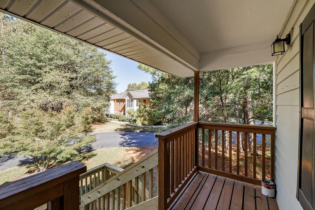 345 Research Drive, Unit 330 Athens, GA 30605 - Photo 28 of 31 a balcony with wooden floor and yard in the back