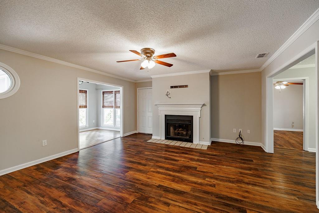 345 Research Drive, Unit 330 Athens, GA 30605 - Photo 6 of 31 a view of empty room with wooden floor and fan